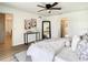 Primary bedroom with king-size bed and access to the patio at 7384 Van Lake Dr, Englewood, FL 34224