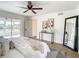 Primary bedroom with king-size bed and access to patio at 7384 Van Lake Dr, Englewood, FL 34224