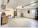 Large garage with utility space and shelving at 7384 Van Lake Dr, Englewood, FL 34224