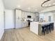 Modern kitchen with gray cabinets, island, and stainless steel appliances at 7384 Van Lake Dr, Englewood, FL 34224