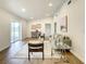 Light-filled living area featuring hardwood floors and access to a sliding glass door at 7384 Van Lake Dr, Englewood, FL 34224