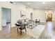 Bright living room with hardwood floors, stylish furniture, and an open floor plan at 7384 Van Lake Dr, Englewood, FL 34224