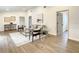 Spacious living room featuring hardwood floors and a comfy sofa at 7384 Van Lake Dr, Englewood, FL 34224