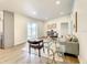 Open living space with hardwood floors, glass top coffee table, and gray sofa at 7384 Van Lake Dr, Englewood, FL 34224