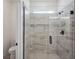 Bathroom with a large walk-in shower and tile surround at 117 Runaway Field Ave, Nokomis, FL 34275
