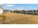 Large backyard with canal views and neighboring houses visible at 1044 Signet Dr, Apollo Beach, FL 33572