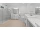 Bathroom with marble shower and soaking tub at 1044 Signet Dr, Apollo Beach, FL 33572