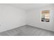Bright bedroom featuring gray carpet and a window with a view at 1044 Signet Dr, Apollo Beach, FL 33572
