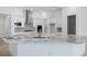 Modern kitchen featuring white cabinets and a large island at 1044 Signet Dr, Apollo Beach, FL 33572