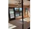 Sunroom with carpet flooring and ceiling fan at 2513 Lancaster Dr, Sun City Center, FL 33573