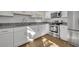 Kitchen features white cabinets, stainless steel appliances, and granite counters at 990 Sunrise Dr, Tarpon Springs, FL 34689