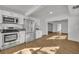 Kitchen boasts stainless steel appliances and white shaker cabinets at 990 Sunrise Dr, Tarpon Springs, FL 34689