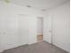Spacious bedroom with carpet and access to another room at 120 Whiteland Bnd, Nokomis, FL 34275