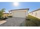 New home with attached garage and paved driveway at 120 Whiteland Bnd, Nokomis, FL 34275