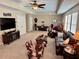 Finished basement with leather furniture, game table, and TV at 1831 Cameron Ct, New Port Richey, FL 34655