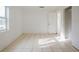Bright bedroom with window and tile floors at 7256 Pinehurst Dr, Spring Hill, FL 34606