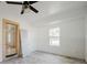 Spacious bedroom with large window and tile floors at 7256 Pinehurst Dr, Spring Hill, FL 34606