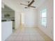Bright dining room with tile floors and ceiling fan at 7256 Pinehurst Dr, Spring Hill, FL 34606