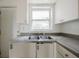 Kitchen with double sink and window at 7256 Pinehurst Dr, Spring Hill, FL 34606