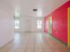 Living Room with pink walls and tile floors at 7256 Pinehurst Dr, Spring Hill, FL 34606