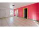 Living Room with pink walls and tile floors at 7256 Pinehurst Dr, Spring Hill, FL 34606