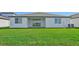 Home exterior showcasing a large backyard at 13851 Richland Gulf Cir, Parrish, FL 34219