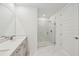 Bathroom with double vanity and walk-in shower at 13851 Richland Gulf Cir, Parrish, FL 34219
