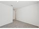 Bright bedroom with plush carpeting and access to a hallway at 13851 Richland Gulf Cir, Parrish, FL 34219