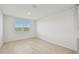 Well-lit bedroom with light wood flooring and a view at 13851 Richland Gulf Cir, Parrish, FL 34219
