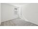 Well-lit bedroom featuring neutral carpeting and a window with blinds at 13851 Richland Gulf Cir, Parrish, FL 34219