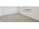Spacious bedroom with neutral carpeting and a window view at 13851 Richland Gulf Cir, Parrish, FL 34219
