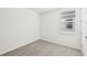 Spacious bedroom with neutral carpeting and ample natural light at 13851 Richland Gulf Cir, Parrish, FL 34219