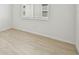 Bedroom with wood-look tile flooring and window at 13851 Richland Gulf Cir, Parrish, FL 34219