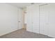 Spacious bedroom with double door closet and neutral carpeting at 13851 Richland Gulf Cir, Parrish, FL 34219