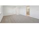 Spacious bedroom with carpet and en-suite bathroom access at 13851 Richland Gulf Cir, Parrish, FL 34219