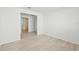Hallway with light wood flooring and access to bedrooms at 13851 Richland Gulf Cir, Parrish, FL 34219