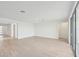 Spacious living area with tile flooring and access to backyard at 13851 Richland Gulf Cir, Parrish, FL 34219
