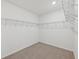 Large walk-in closet with wire shelving at 13851 Richland Gulf Cir, Parrish, FL 34219