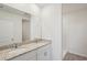 Bathroom with granite countertop double vanity and shower at 14036 Crutchfield Ct, Parrish, FL 34219