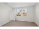 Bright bedroom featuring neutral carpeting and large windows at 14036 Crutchfield Ct, Parrish, FL 34219