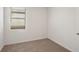 Bright bedroom with carpeted floor and window with blinds at 14036 Crutchfield Ct, Parrish, FL 34219