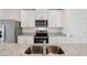 Modern kitchen sink and granite countertop with stainless steel appliances at 14036 Crutchfield Ct, Parrish, FL 34219