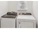 Laundry room with Whirlpool washer and dryer at 14036 Crutchfield Ct, Parrish, FL 34219