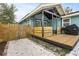 Backyard with deck, grill, and wood fence at 2514 Beach S Blvd, Gulfport, FL 33707