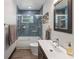 Bathroom with tub, shower, and single vanity at 2514 Beach S Blvd, Gulfport, FL 33707