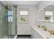 Modern bathroom with double vanity and walk-in shower at 2514 Beach S Blvd, Gulfport, FL 33707
