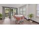 Bright dining area with table and chairs, view of pool at 2514 Beach S Blvd, Gulfport, FL 33707