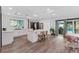 Modern kitchen with island, pool view, and dining area at 2514 Beach S Blvd, Gulfport, FL 33707