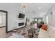Open living area featuring a fireplace, comfortable seating, and open kitchen at 2514 Beach S Blvd, Gulfport, FL 33707