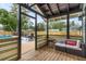 Covered patio with seating and pool view at 2514 Beach S Blvd, Gulfport, FL 33707
